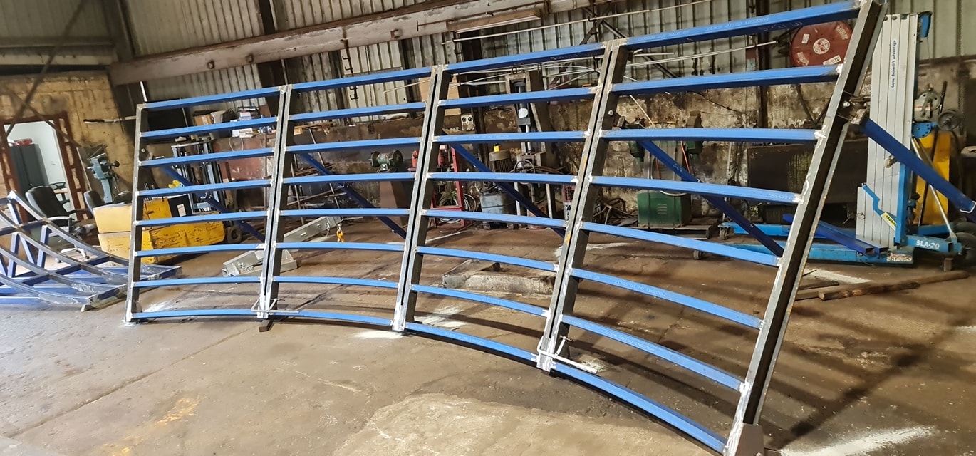 Steelbiz crew installing structural steel rafters on site